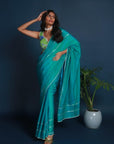 Green Blue Kit Kat Satin Plain Saree with Silver Gota Patti with Pearl Border and Green Abstract Floral Embroidered Blouse Set.